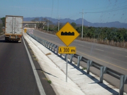 Dave Clingman and Andrew Wharton approach topes (speed bumps) on Mexico cuota (toll road)