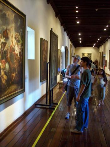 Andrew Wharton and friend Jacob view paintings at Guadalajara's Regional Museum